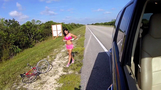 Nadia Capri was out in the Glades training on her bike, when her tire blew. Good thing some dude spotted her by the freeway flashing those sweet tits. He offered a ride, before long her mouth was wrapped tight around his cock, then he pounded that latina pussy!