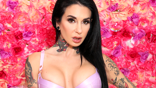 Flowers and bubbles surround gorgeous Joanna Angel, who is looking as glam as can be! She runs her hands all over her body, while her big tits practically burst out of her baby pink lingerie set. Let us take you on a tour of Joanna's body while she teases off her lingerie piece by piece. She starts with her bra, giving you a taste of her luscious tits as she pinches her nipples. Joanna always keeps you wanting more, slipping off her panties with such masterful seduction. Starring: Joanna Angel. (Video duration: 07:38)